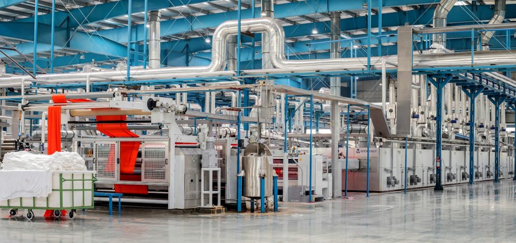 Textile factory floor with fabric processing machines