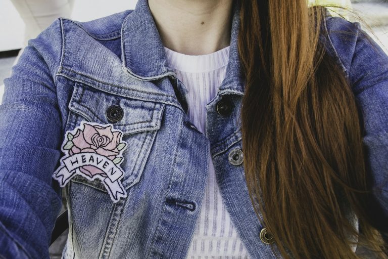 Embroidered rose patch on a denim jacket