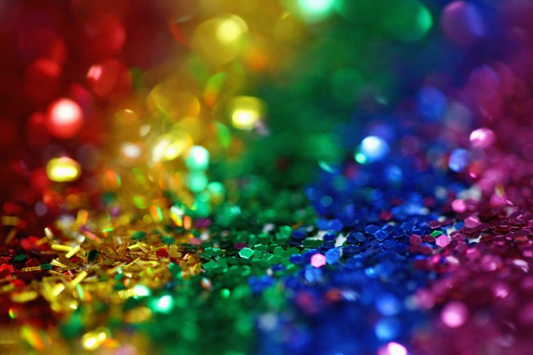 Rainbow of red, yellow, green and blue glitter