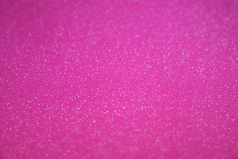Bright pink glitter spread flat