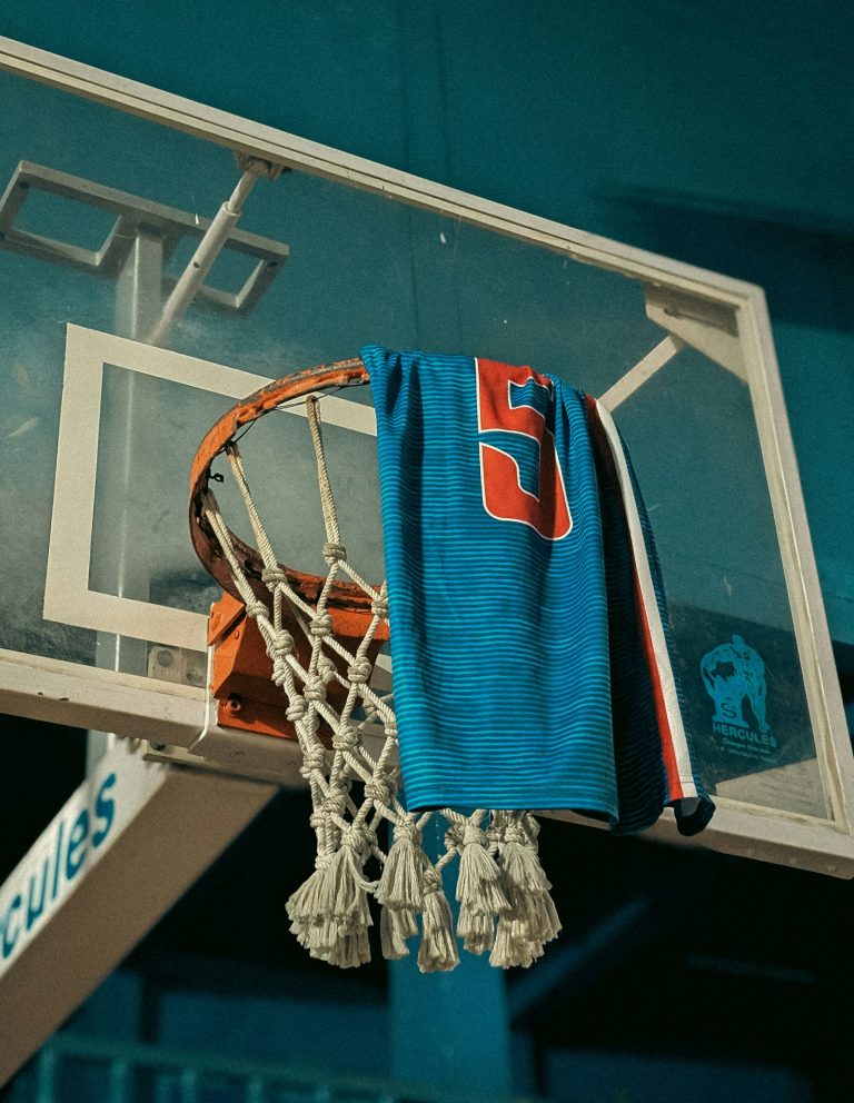 Basketball shirt with a number hanging from a hoop