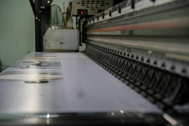 Inside a wide-format printer along the print bed