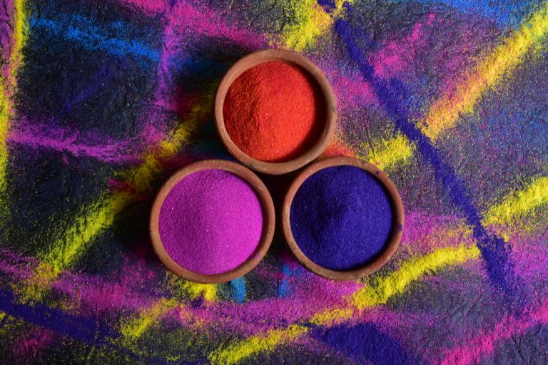 Bowls of red, pink and purple pigment